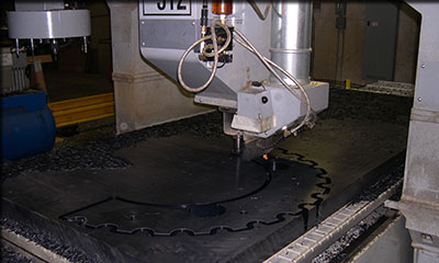 Precision CNC machining of a metal component at Maximum Industries