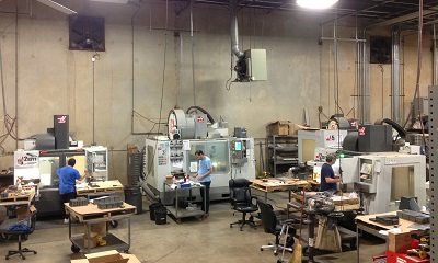 Haas CNC milling center running a production part at Maximum Industries